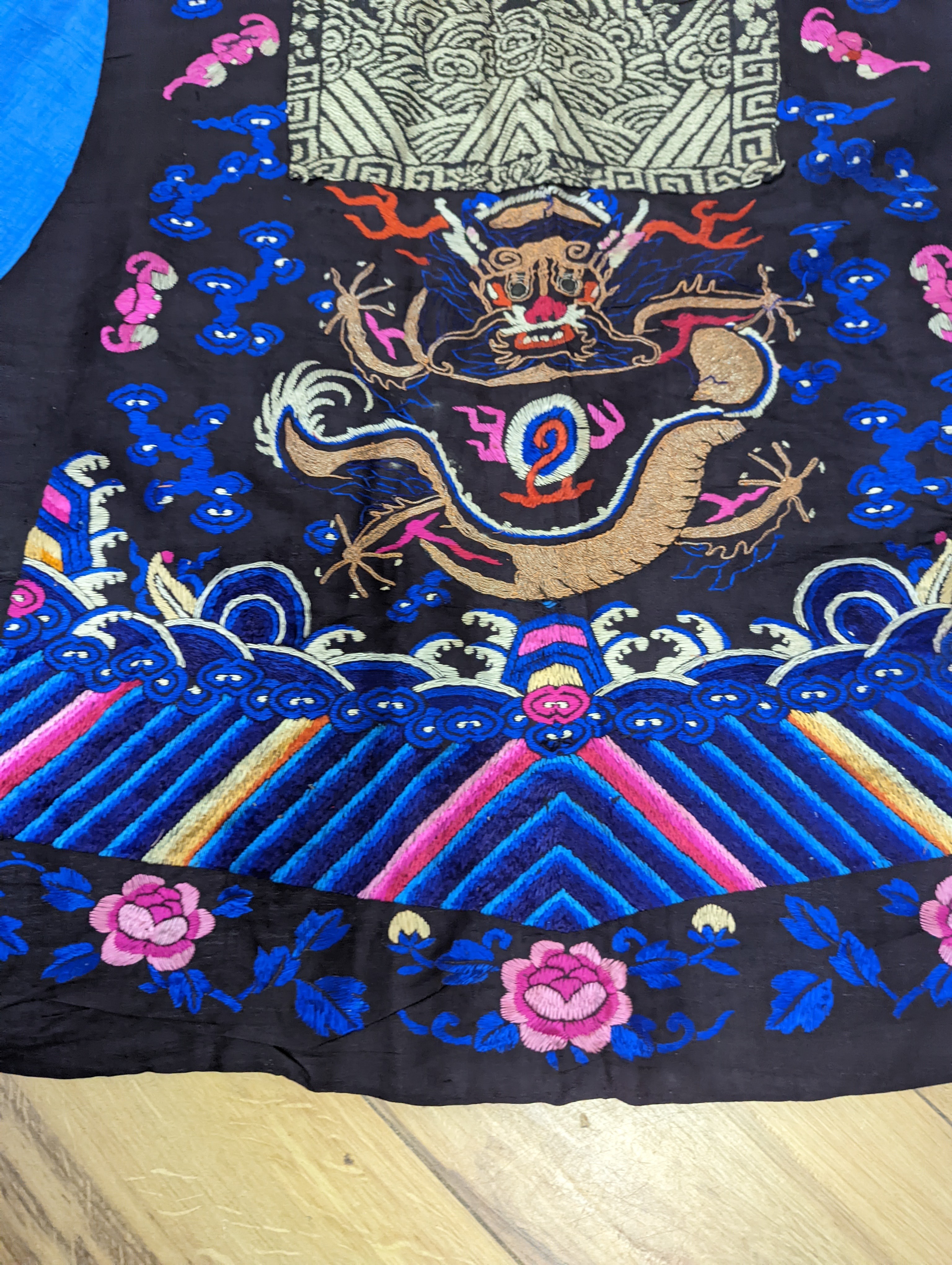 A 1920's Chinese dragon embroidered waistcoat, a cream silk drawn thread dress and a silk crepe black and patterned reversible kimono (3 items).